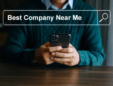 A person searching for the best company near me on a phone